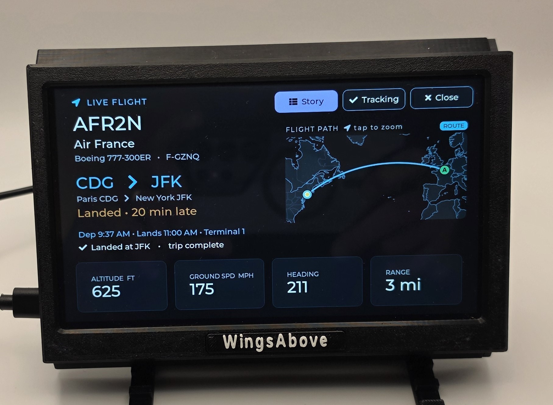 Live tracking view: flight path map, terminal, on-time status, and live altitude, speed, heading and range tiles