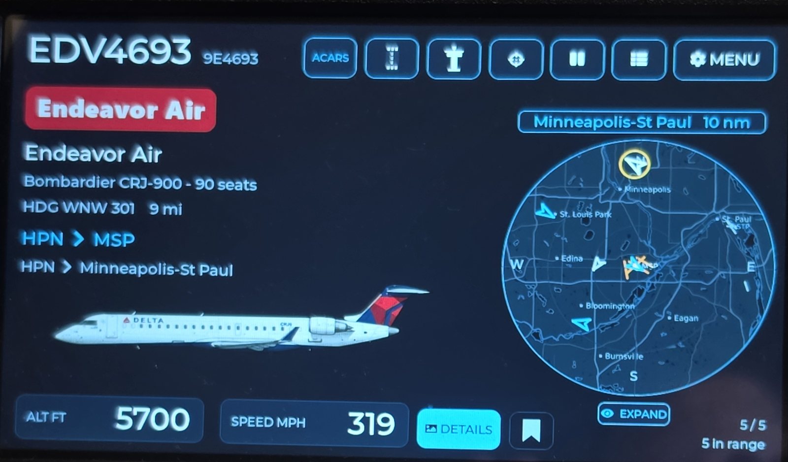 The WingsAbove flight card showing flight EDV4693, a Bombardier CRJ-900 from White Plains to Minneapolis-St Paul, with the radar on the right.