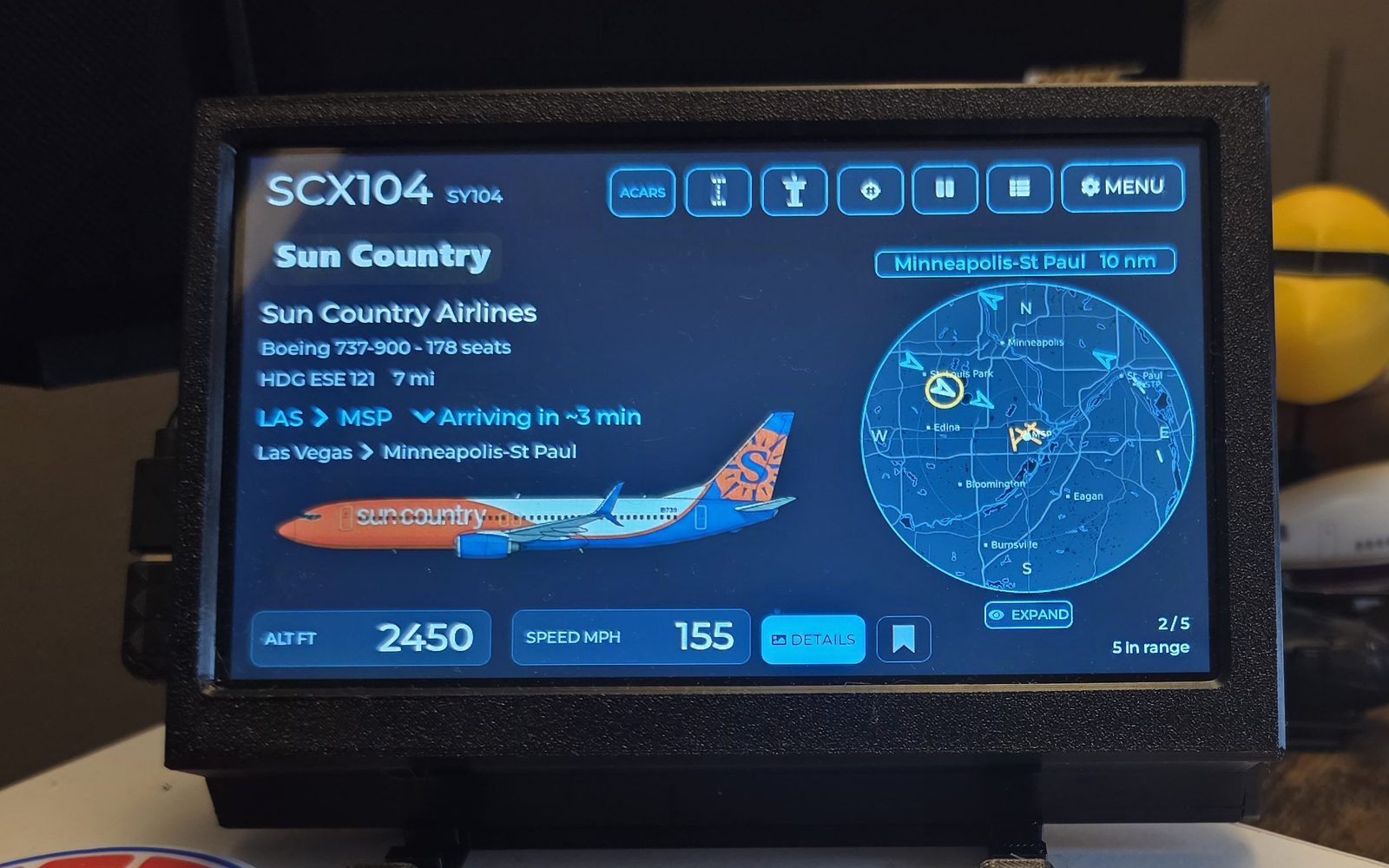 WingsAbove current flight card showing SCX104, a Boeing 737-900 from Las Vegas arriving Minneapolis-St Paul in about three minutes, with altitude, speed and nearby radar traffic
