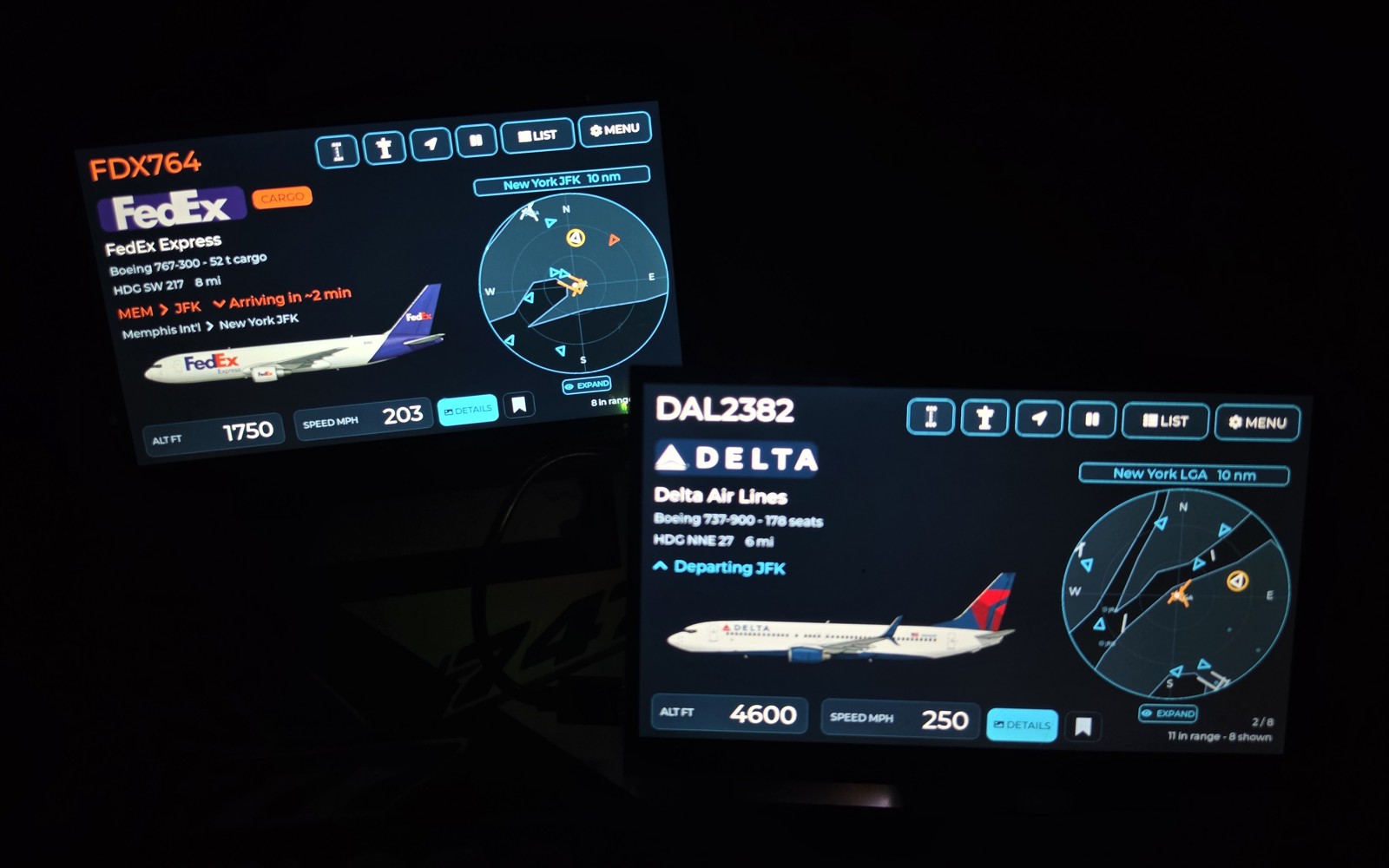 Two WingsAbove 7-inch flight-tracking displays showing live FedEx and Delta flights with aircraft liveries and nearby radar traffic