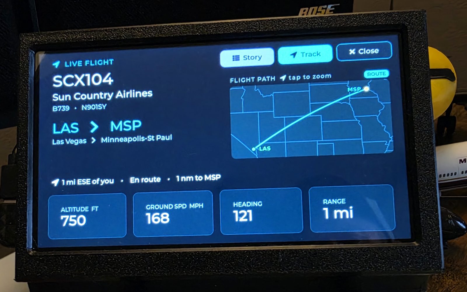 WingsAbove live flight view for SCX104, a Boeing 737-900 from Las Vegas to Minneapolis-St Paul on short final, showing the flight path, 1 nm to run, altitude, ground speed, heading and range